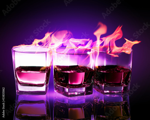Photo: Three glasses of burning purple absinthe Three glasses of burning purple absinthe