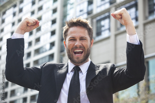 Photo: Young Successful Business Man Celebrating in City Young Successful Business Man Celebrating in City