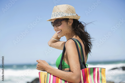 Photo: Beautiful woman smiling on the beach Beautiful woman smiling on the beach