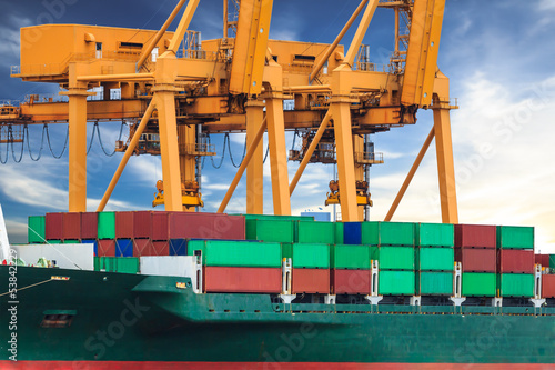 Photo: crane working with container cargo in shipyard crane working with container cargo in shipyard