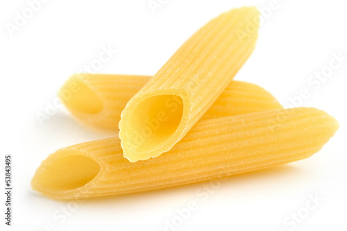 Photo: three penne isolated on white background three penne isolated on white background