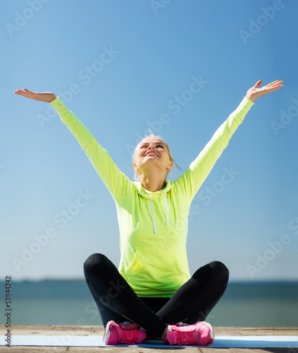 Photo: woman doing yoga outdoors woman doing yoga outdoors