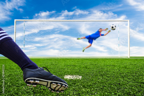 Photo: foot kicking soccer ball foot kicking soccer ball