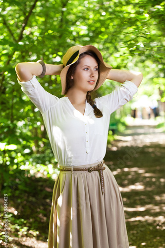 Photo: Beautiful young woman in an elegant hat Beautiful young woman in an elegant hat