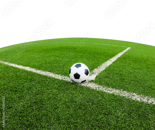 Photo: soccer ball on green grass field isolated soccer ball on green grass field isolated