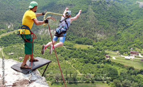 Photo: Jump off a cliff with a rope. Jump off a cliff with a rope.