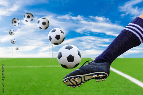 Photo: foot kicking soccer ball foot kicking soccer ball