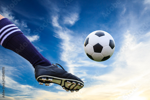 Photo: foot kicking soccer ball foot kicking soccer ball