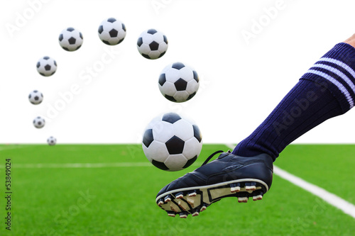 Photo: foot kicking soccer ball isolated foot kicking soccer ball isolated