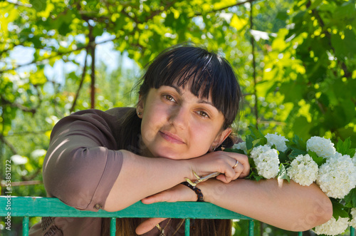 Photo: Beautiful woman in a spring garden Beautiful woman in a spring garden