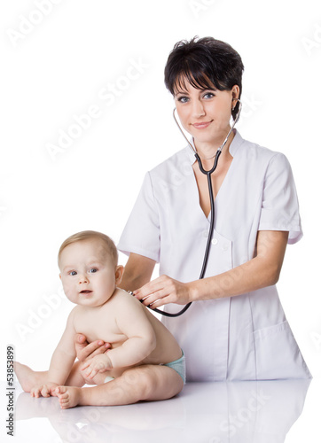 Photo: beautiful doctor and baby on a white background. beautiful doctor and baby on a white background.