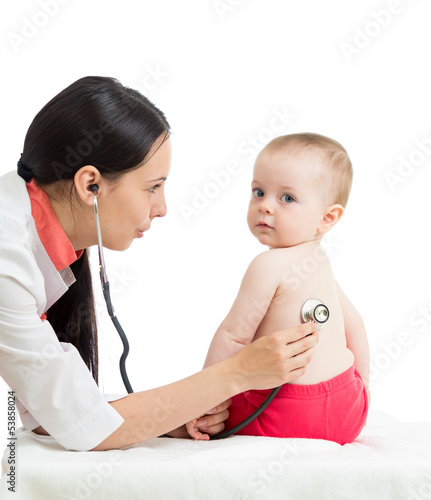 Photo: doctor examining kid girl isolated on white doctor examining kid girl isolated on white