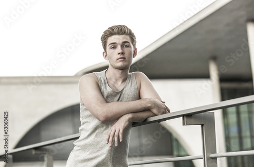 Photo: Man leaning rail Man leaning rail