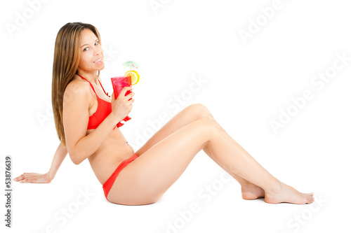 Photo: Woman in bikini having a drink Woman in bikini having a drink