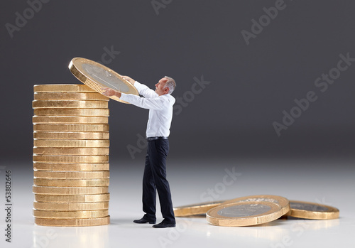 Photo: Senior man saving money Senior man saving money