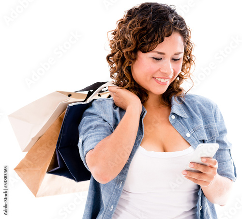 Photo: Shopping woman with smart phone Shopping woman with smart phone