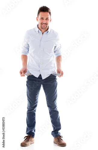 Photo: Broke man with empty pockets Broke man with empty pockets