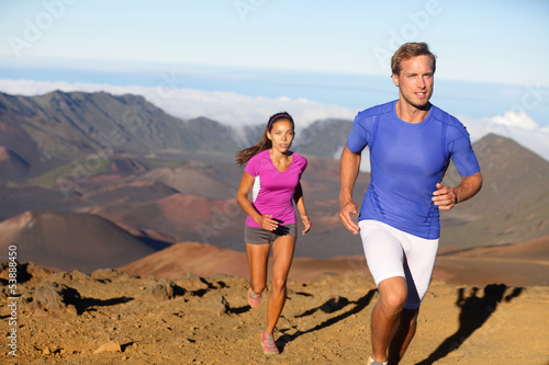 Photo: Running sport - trail runners in cross country run Running sport - trail runners in cross country run