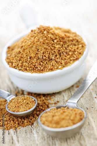 Photo: Coconut palm sugar in measuring spoons Coconut palm sugar in measuring spoons