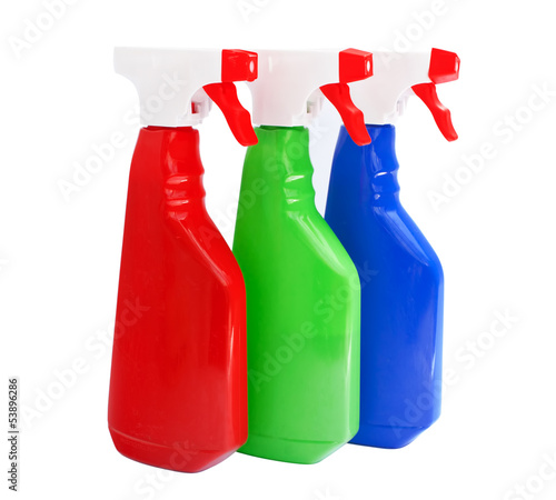 Photo: cleaning products bottles isolated on white cleaning products bottles isolated on white