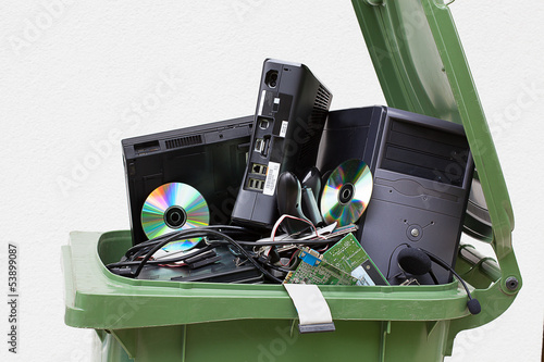 Discarded computer in litter bin