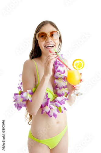 Photo: Hawaii woman in bikini wearing flower lei garland of pink orchid Hawaii woman in bikini wearing flower lei garland of pink orchid