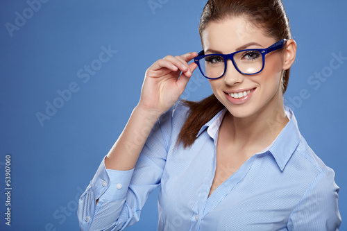 Photo: Cute young business woman with glasses Cute young business woman with glasses