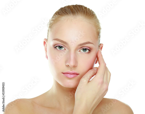 Photo: A beautiful woman touching her face, portrait A beautiful woman touching her face, portrait
