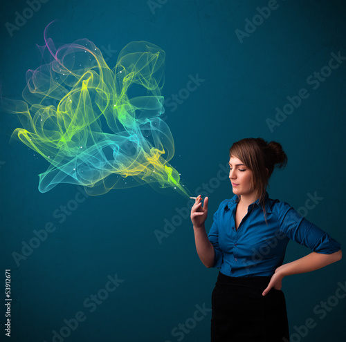 Photo: Pretty lady smoking cigarette with colorful smoke Pretty lady smoking cigarette with colorful smoke