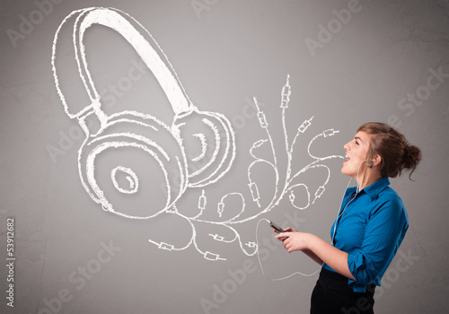 Photo: young woman singing and listening to music with abstract headpho young woman singing and listening to music with abstract headpho