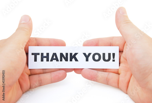 Photo: hands holding paper of thank you with clipping path hands holding paper of thank you with clipping path