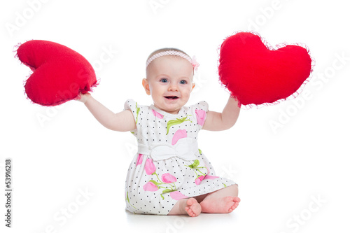Photo: baby girl with pillow in heart shape baby girl with pillow in heart shape
