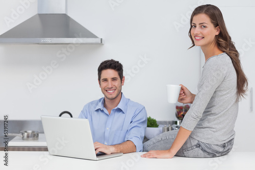 Photo: Portrait of a couple in the kitchen Portrait of a couple in the kitchen