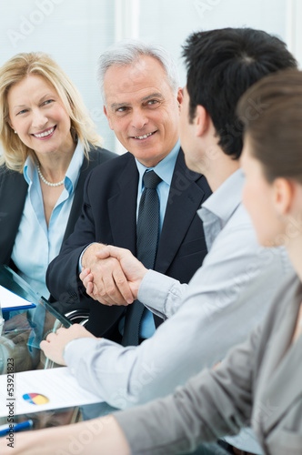Photo: Handshake Between Two Businesspeople Handshake Between Two Businesspeople