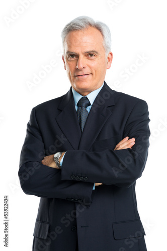Photo: Portrait Of Senior Businessman With Hands Folded Portrait Of Senior Businessman With Hands Folded