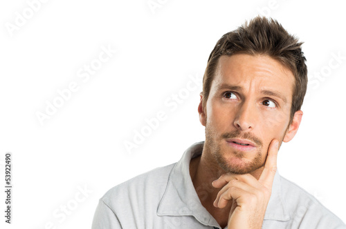 Photo: Portrait Of Thoughtful Young Man Portrait Of Thoughtful Young Man