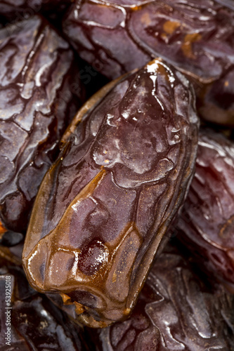 Photo: Dried date fruits background Dried date fruits background