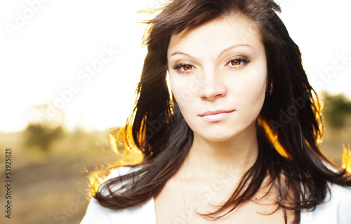 Photo: Young woman outdoors portrait. Summer Young woman outdoors portrait. Summer
