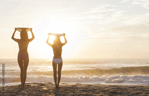 Photo: Bikini Women Surfers & Surfboards Sunset Beach Bikini Women Surfers & Surfboards Sunset Beach