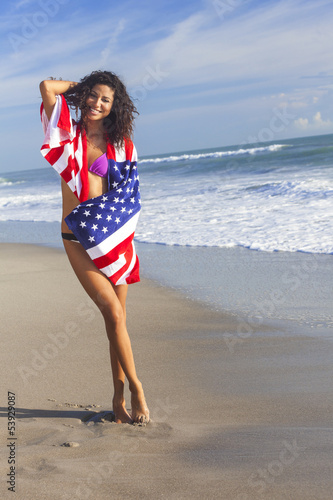 Photo: Sexy Young Woman Girl in American Flag on Beach Sexy Young Woman Girl in American Flag on Beach