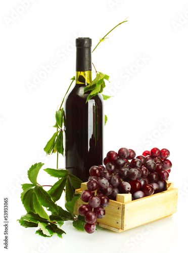 Photo: bottle of wine with grapes isolated on white bottle of wine with grapes isolated on white