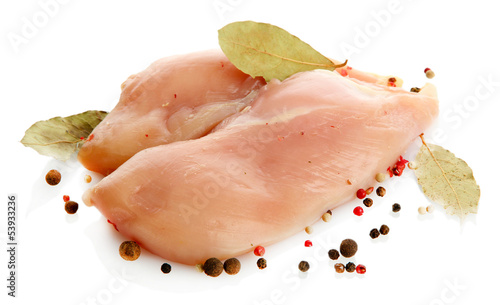 Photo: raw chicken meat with spices, isolated on white raw chicken meat with spices, isolated on white