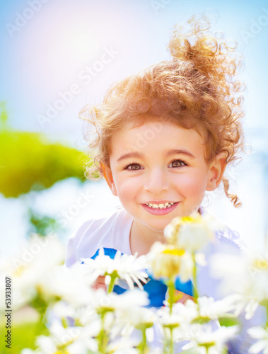 Photo: Little boy on daisy field Little boy on daisy field