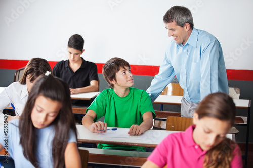 Photo: Male University Student And Professor Looking At Each Other Male University Student And Professor Looking At Each Other