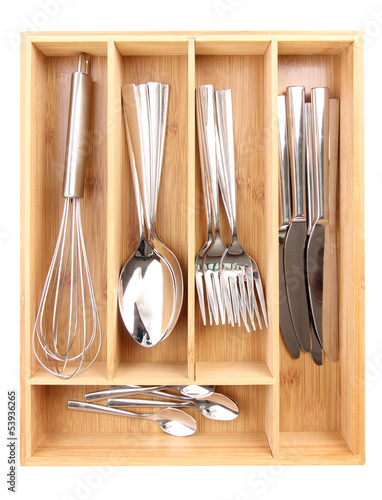 Photo: Wooden cutlery box with checked cutlery isolated on white Wooden cutlery box with checked cutlery isolated on white