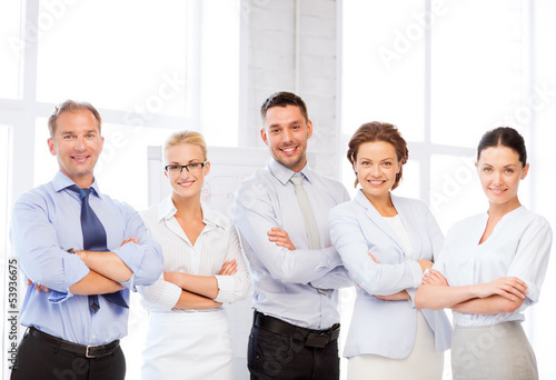 Photo: happy business team in office happy business team in office