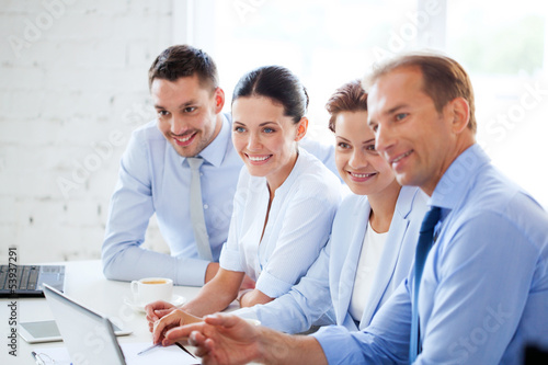 Photo: business team having meeting in office business team having meeting in office