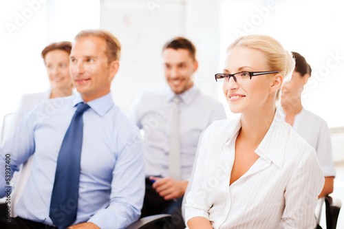 Photo: businessmen and businesswomen on conference businessmen and businesswomen on conference