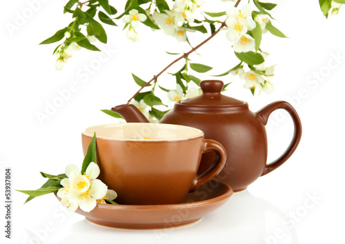 Photo: Cup of tea with jasmine, isolated on white Cup of tea with jasmine, isolated on white