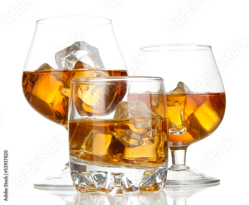 Photo: Brandy glasses with ice isolated on white Brandy glasses with ice isolated on white